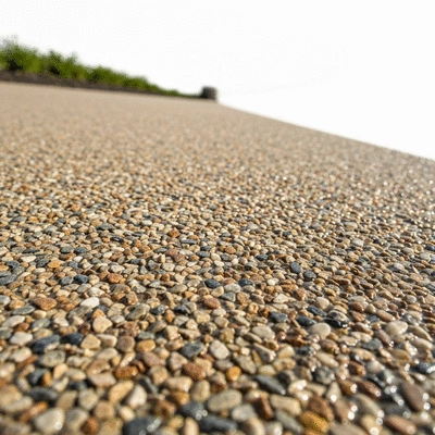 Close-up view of decorative aggregates in a resin driveway, showing varied textures and colors, no text, no words, no typography, clean image